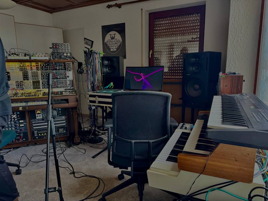 The studio room with modular rack, monitors, keyboards