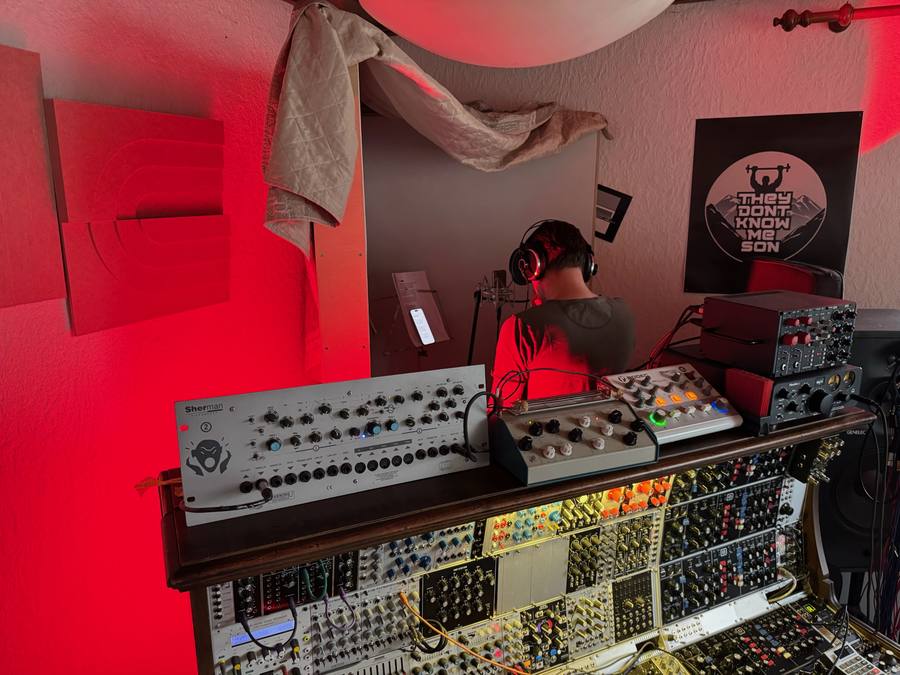 Vocal take in the red-lit corner of the studio